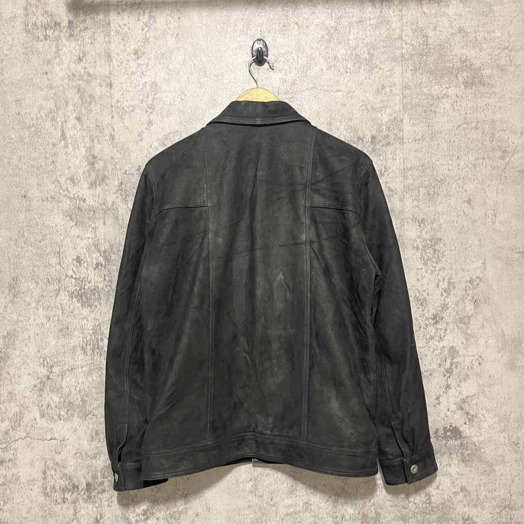 Italian Leather Trucker Jacket (Category: Coats, Jackets and Outerwear) located in Rizal. Submitted by wornout (Listing ID 1456876296, Image 2). Description: Italian Leather Trucker Jacket Minimalist black leather trucker jacket crafted with premium imported Italian sheepskin. The leather features a unique finish combining the rugged look of grained leather with a soft, velvety nubuck texture. This piece has no visible branding, offering a clean 