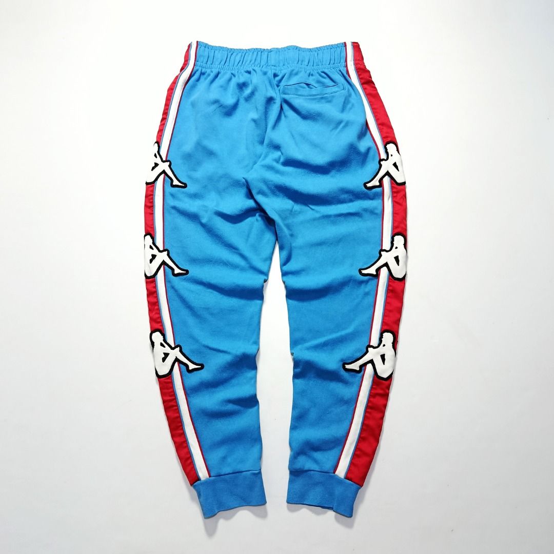 Kappa Logo Tape Track Joggers (Category: Joggers) located in Taytay. Submitted by hoodgrail.vtg (Listing ID 1456843481, Image 2). Description: • Excellent condition - Lightly used • Bold all-over Omini logo side panels with blue/red color blocking • Size on tag: M — best fits 32 • Measurements: 15-17 x 38 in • Leg opening: 5 in elastic • Color rate: 9.5/10 • Issue: None.