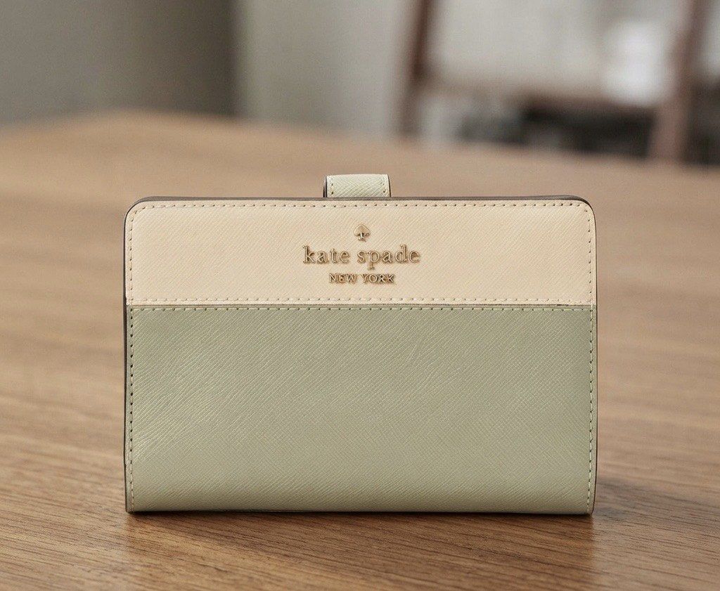 Kate Spade Leather Two Tone Bifold Wallet - Madison (Category: Wallets & Card holders) located in Quezon City. Submitted by mnl.drops (Listing ID 1421895516, Image 1). Description: ✨ Keep your essentials neatly organized in style! ✨ Looking for a compact wallet that packs a major organizational punch? This chic accessory holds all your cards, cash, and coins while keeping your look effortlessly polished. 📋 Product Details: Color: Sage Material: 