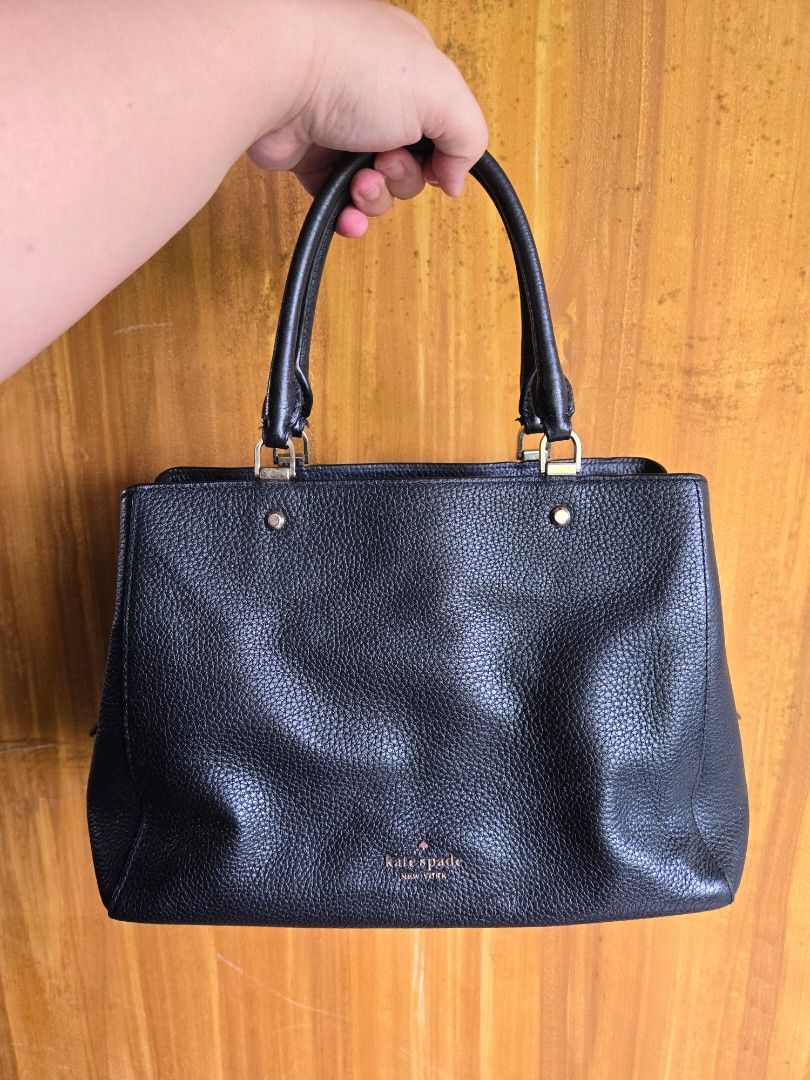 Kate Spade Leila Medium Black Leather Satchel Bag (Category: Luxury Bags & Wallets) located in Quezon City. Submitted by lagpaoiya (Listing ID 1456841507, Image 1). Description: - Classic black Kate Spade handbag - Genuine pebbled leather - Elegant gold hardware - Comfortable top handles - Spacious interior for essentials - Versatile for daily use or special events.