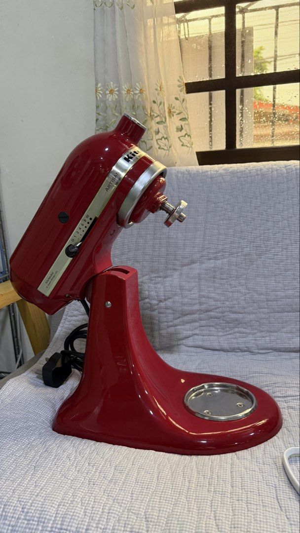 KitchenAid Artisan Red Stand Mixer with Attachments (Category: Hand & Stand Mixers) located in Quezon City. Submitted by amogz (Listing ID 1456944841, Image 1). Description: - Red KitchenAid Artisan Stand Mixer - Includes stainless steel bowl, dough hook, flat beater, and wire whisk - Powerful and reliable for all baking needs - Ideal for whipping cream, kneading dough, and mixing batters - A classic kitchen essential - 110volts.