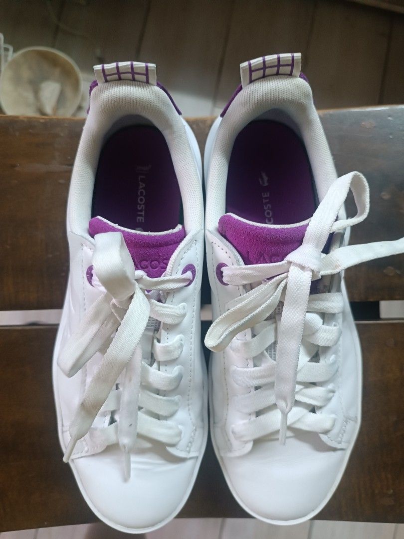 Lacoste Carnaby Plat White Purple Platform Sneakers (Category: Sneakers) located in Quezon City. Submitted by convert2cash (Listing ID 1456827649, Image 2). Description: - White leather Lacoste sneakers - Purple accent details - Platform sole for added height - Size: 7 US / 38 EU - Ideal for casual wear.