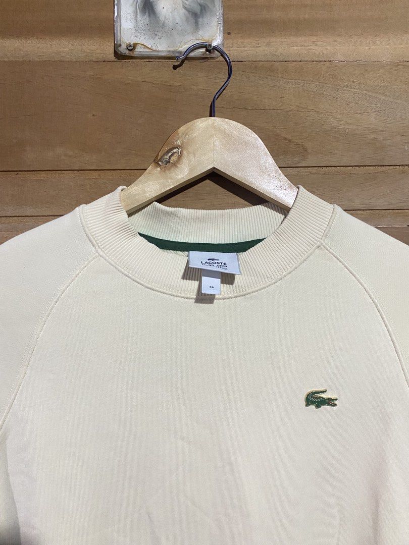 Lacoste pull over cream white (Category: Coats, Jackets and Outerwear) located in Manila. Submitted by sixbysix (Listing ID 1456932812, Image 3). Description: Dimes 19-20x25 Condition 10/10 Color rate 10/10 Issue none .