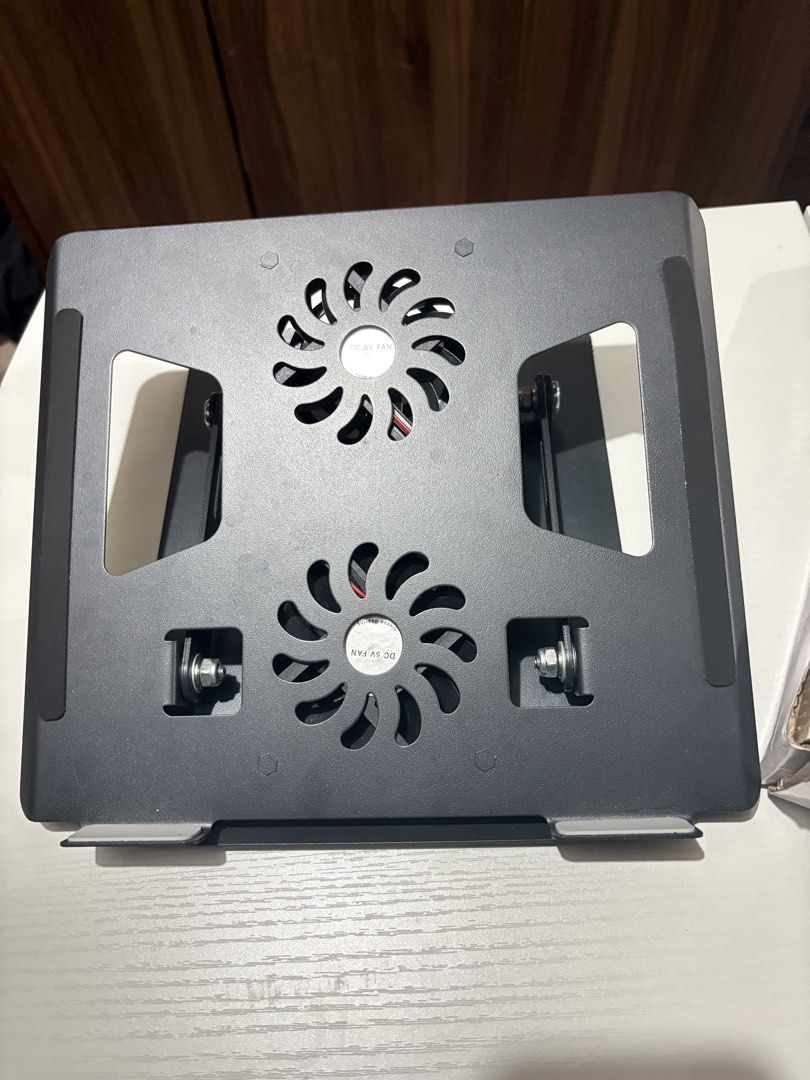 LAPTOP STAND WITH FAN (Category: Laptop Bags & Sleeves) located in Quezon City. Submitted by siooobeee_ (Listing ID 1456877170, Image 2). Description: - INPLAY Laptop Stand with Cooling Fans - Model: LPT-1 - Color: Black - Features built-in fans to prevent overheating - Adjustable for optimal viewing and typing angles - Durable and stable design - Almost brand new payment: bpi/gcash delivery: grab/lalamove location: manila.