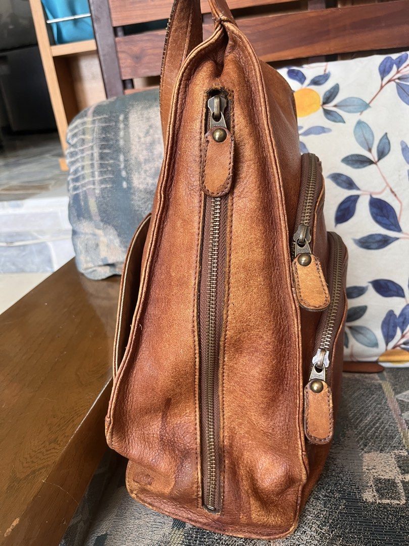 Leather backpack (Category: Backpacks) located in Los Banos. Submitted by profemy (Listing ID 1456802588, Image 3). Description: Vintage genuine-leather backpack. Has watermarks and some scratches, visible in the last pictures. This bag is vintage and, as expected, has flaws, but has so much life left in it. It is also spacious. will ship by J&T. Add 150 for shipping . .