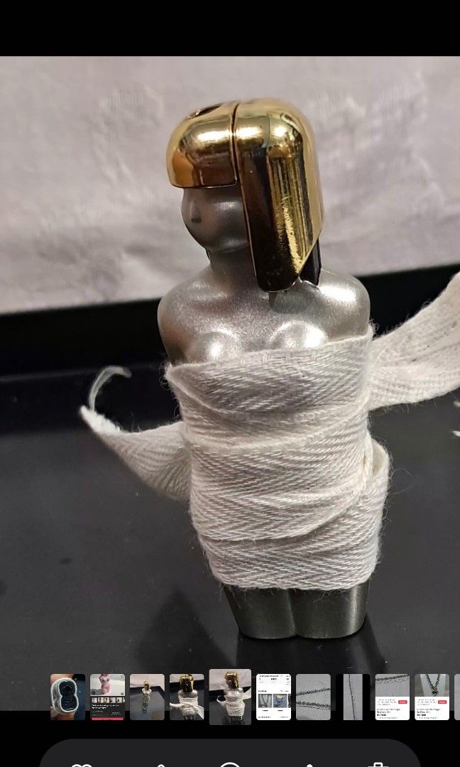 LIGHTER VINTAGE SILVER TONE (Category: Vintage Collectibles) located in Cavite. Submitted by jp477 (Listing ID 1456785400, Image 1). Description: Vintage silver-tone female torso table lighter with a polished gold-tone cap and asymmetrical hairstyle detail. Will pm photo without cover for interested buyers. Good condition..