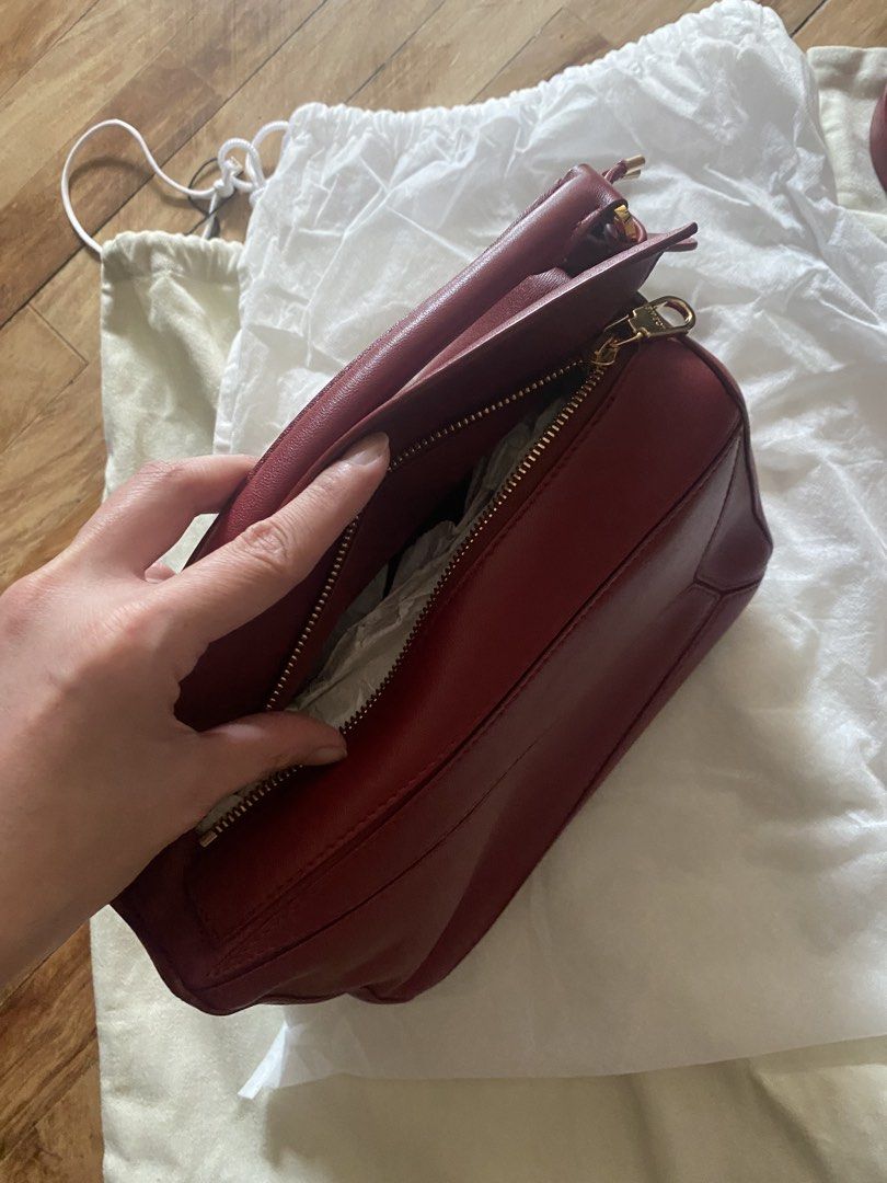 LOEWE Featherlight Puzzle Bag (Category: Luxury Bags & Wallets) located in Muntinlupa City. Submitted by cssshop (Listing ID 1456808017, Image 3). Description: LOEWE Featherlight Puzzle Small Bag in Burnt Red Used only twice In mint condition Complete with cards and dust bags .