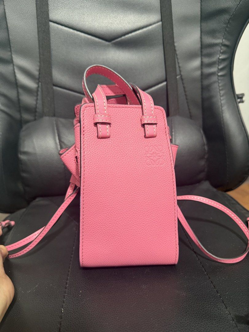 Loewe Pink Leather Mini Bucket Bag (Category: Luxury Bags & Wallets) located in Antipolo. Submitted by declutteringirlie0317 (Listing ID 1456933985, Image 3). Description: - Pink leather mini bucket bag - Drawstring closure - Top handles and a long strap - Embossed Loewe logo on the front - Compact and perfect for carrying essentials.
