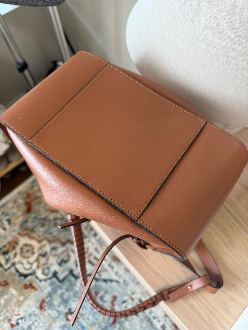 Loewe Puzzle Bag Tan Leather (Category: Luxury Bags & Wallets) located in Manila. Submitted by emceebee (Listing ID 1456789853, Image 2). Description: - Authentic Loewe Puzzle bag - Size: Medium - Color: Tan leather - Closure: Zipper with tassel detail - Style: Great everyday bag - Interior: Plenty of space .
