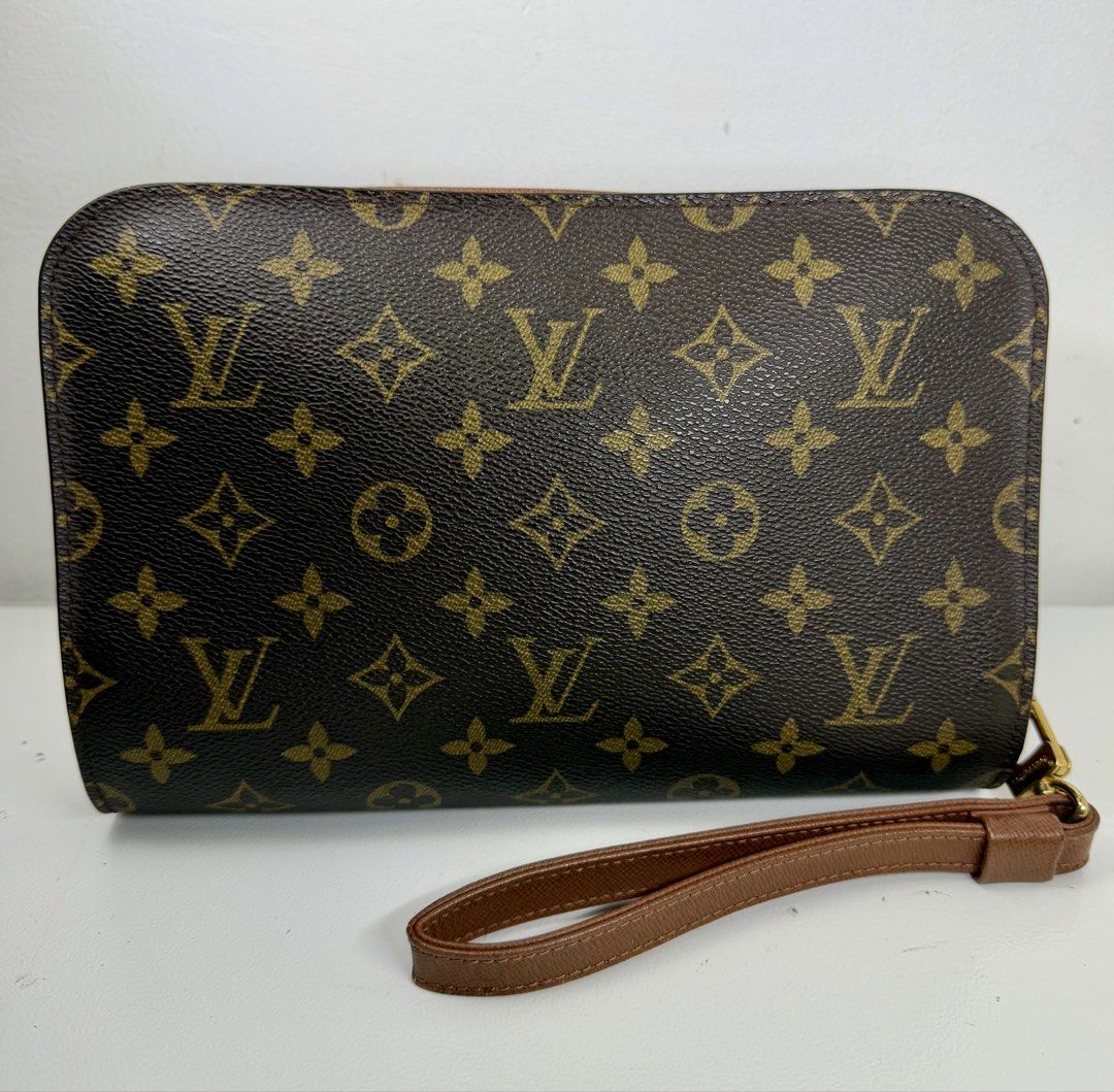 Louis Vuitton Monogram Orsay Clutch Bag (Category: Luxury Bags & Wallets) located in Manila. Submitted by importgoodiesph (Listing ID 1456824254, Image 3). Description: Louis Vuitton Monogram Orsay Clutch Bag - in good condition - dimensions: W - 24cm; H - 15.5cm; D - 6 cm - made in France - gold-tone hardwares - zipper closure on top - 1 exterior pocket, 1 interior pocket (both are sticky and peeling as seen on photos) - clutch bag only, no othe