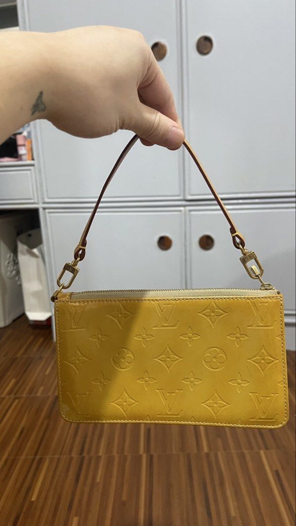 Louis Vuitton Monogram Vernis Yellow Clutch Bag (Category: Luxury Bags & Wallets) located in Valenzuela. Submitted by pillows06 (Listing ID 1456893542, Image 2). Description: - Authentic Yellow Louis Vuitton clutch - Made from signature Monogram Vernis leather - Features a detachable gold chain strap - Includes a removable leather wrist strap - Secure zipper closure - Interior is clean and well-maintained - Ideal for evening events or as a stylis