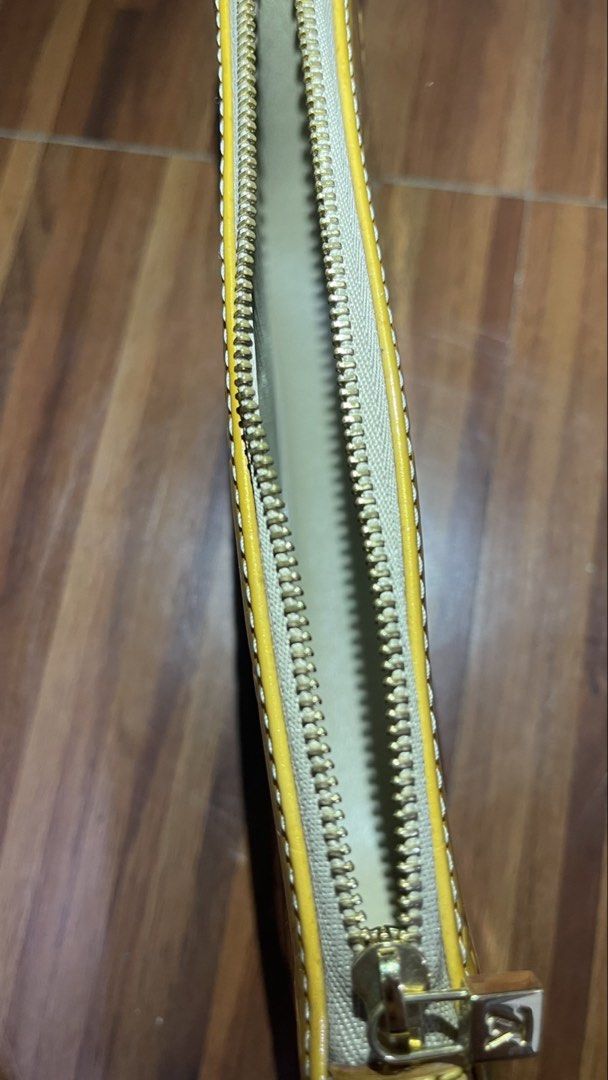 Louis Vuitton Monogram Vernis Yellow Clutch Bag (Category: Luxury Bags & Wallets) located in Valenzuela. Submitted by pillows06 (Listing ID 1456893542, Image 3). Description: - Authentic Yellow Louis Vuitton clutch - Made from signature Monogram Vernis leather - Features a detachable gold chain strap - Includes a removable leather wrist strap - Secure zipper closure - Interior is clean and well-maintained - Ideal for evening events or as a stylis