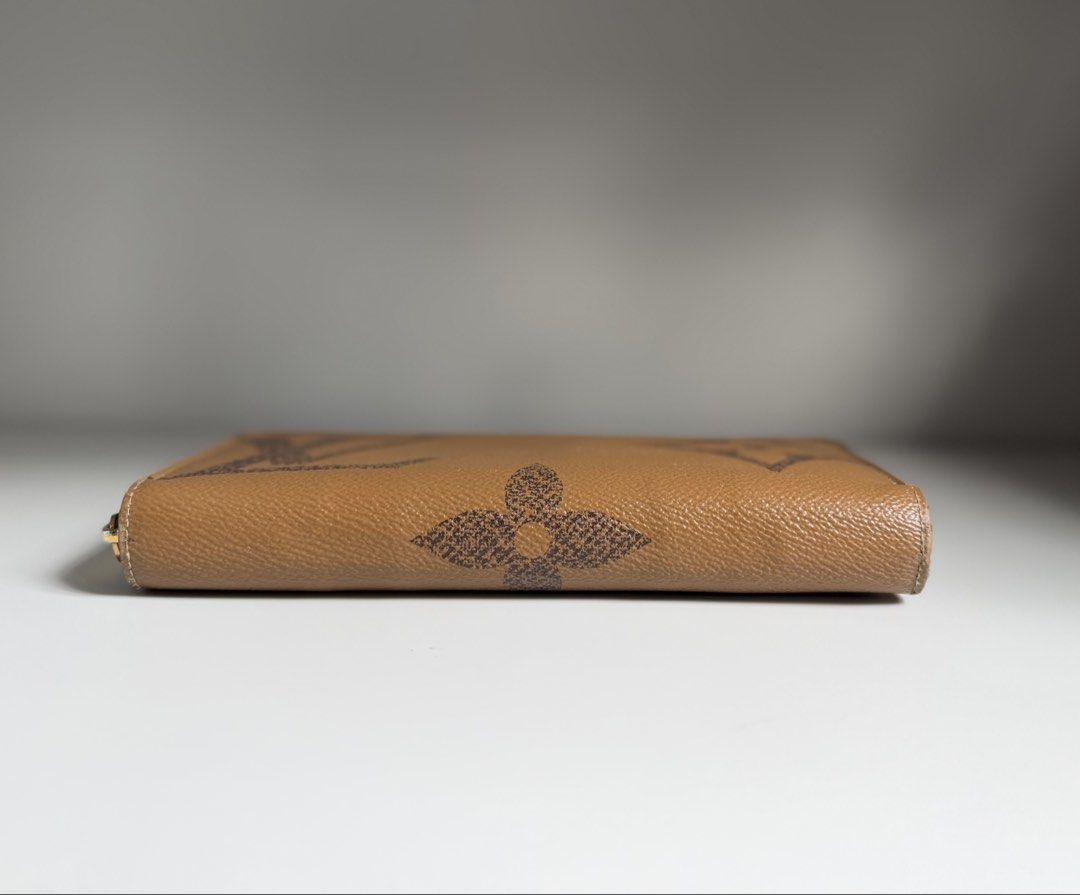 Louis Vuitton zippy long wallet reverse giant monogram LV (Category: Luxury Bags & Wallets) located in Quezon City. Submitted by ksumer (Listing ID 1456854570, Image 3). Description: - Authentic Louis Vuitton wallet - Classic monogram canvas (brown/tan) - Secure zip-around closure - Ample card slots and compartments for organization - Comes with original Louis Vuitton box - Ideal for keeping your essentials tidy and accessible With signs if use.