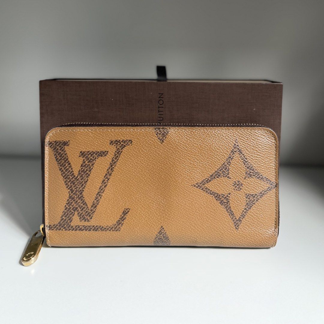 Louis Vuitton zippy long wallet reverse giant monogram LV (Category: Luxury Bags & Wallets) located in Quezon City. Submitted by ksumer (Listing ID 1456854570, Image 1). Description: - Authentic Louis Vuitton wallet - Classic monogram canvas (brown/tan) - Secure zip-around closure - Ample card slots and compartments for organization - Comes with original Louis Vuitton box - Ideal for keeping your essentials tidy and accessible With signs if use.