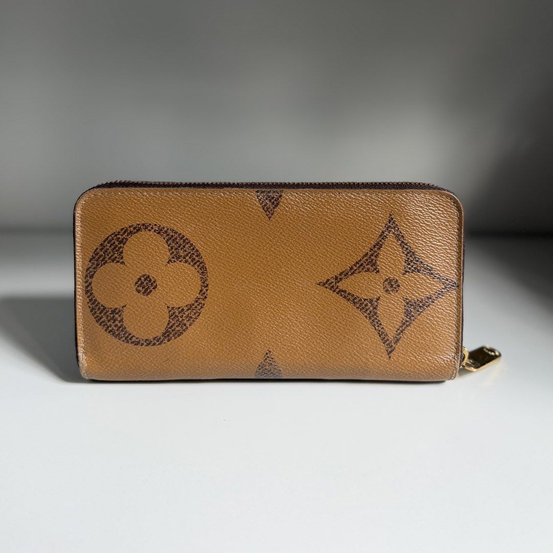 Louis Vuitton zippy long wallet reverse giant monogram LV (Category: Luxury Bags & Wallets) located in Quezon City. Submitted by ksumer (Listing ID 1456854570, Image 2). Description: - Authentic Louis Vuitton wallet - Classic monogram canvas (brown/tan) - Secure zip-around closure - Ample card slots and compartments for organization - Comes with original Louis Vuitton box - Ideal for keeping your essentials tidy and accessible With signs if use.