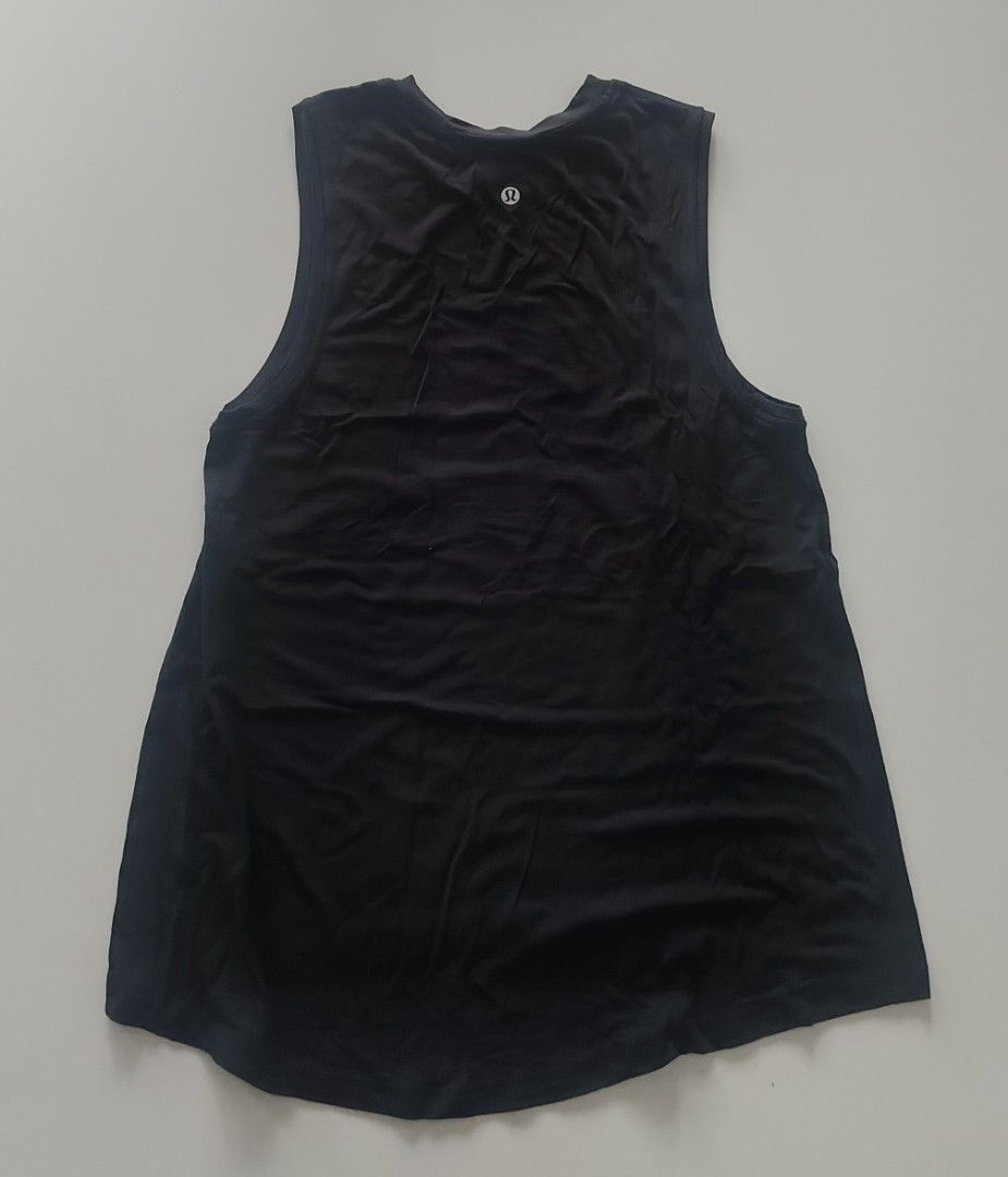 Lululemon Black Tank Top Size 4 (Category: Activewear) located in Muntinlupa City. Submitted by cezzy82 (Listing ID 1456844650, Image 2). Description: - Black Lululemon tank top - Sleeveless design - Size 4 - Ideal for workouts or casual wear - Comfortable and breathable fabric - Versatile: pairs easily with leggings or shorts.