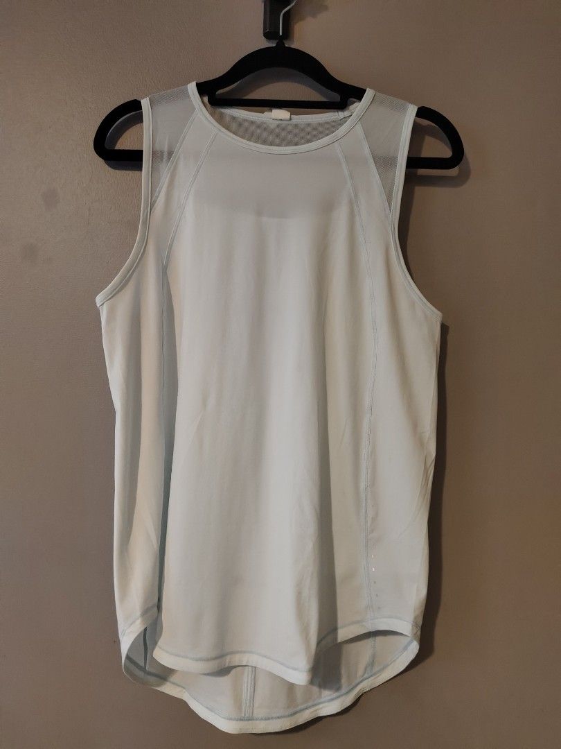 Lululemon Light Blue Mesh Back Tank Top Size 4 (Category: Activewear) located in Muntinlupa City. Submitted by cezzy82 (Listing ID 1456840704, Image 1). Description: - Light blue Lululemon tank top - Size 4 - Mesh back with cut-out detail - Sleeveless design - Curved hem - Ideal for workouts or casual wear.