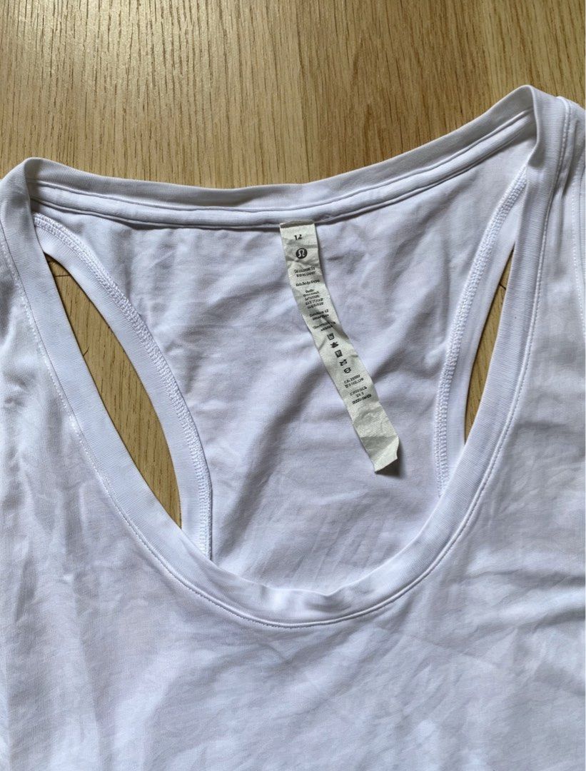 Lululemon White Racerback Tank Top (Category: Activewear) located in Manila. Submitted by tygaangub1096 (Listing ID 1456920924, Image 2). Description: - White Lululemon tank top - Racerback style - Ideal for workouts or casual wear - Made with soft and breathable fabric - Easy to pair with any outfit - A comfortable wardrobe staple - Size 12 on tag - 19.5 width 26.5 length - Add shipping fee .