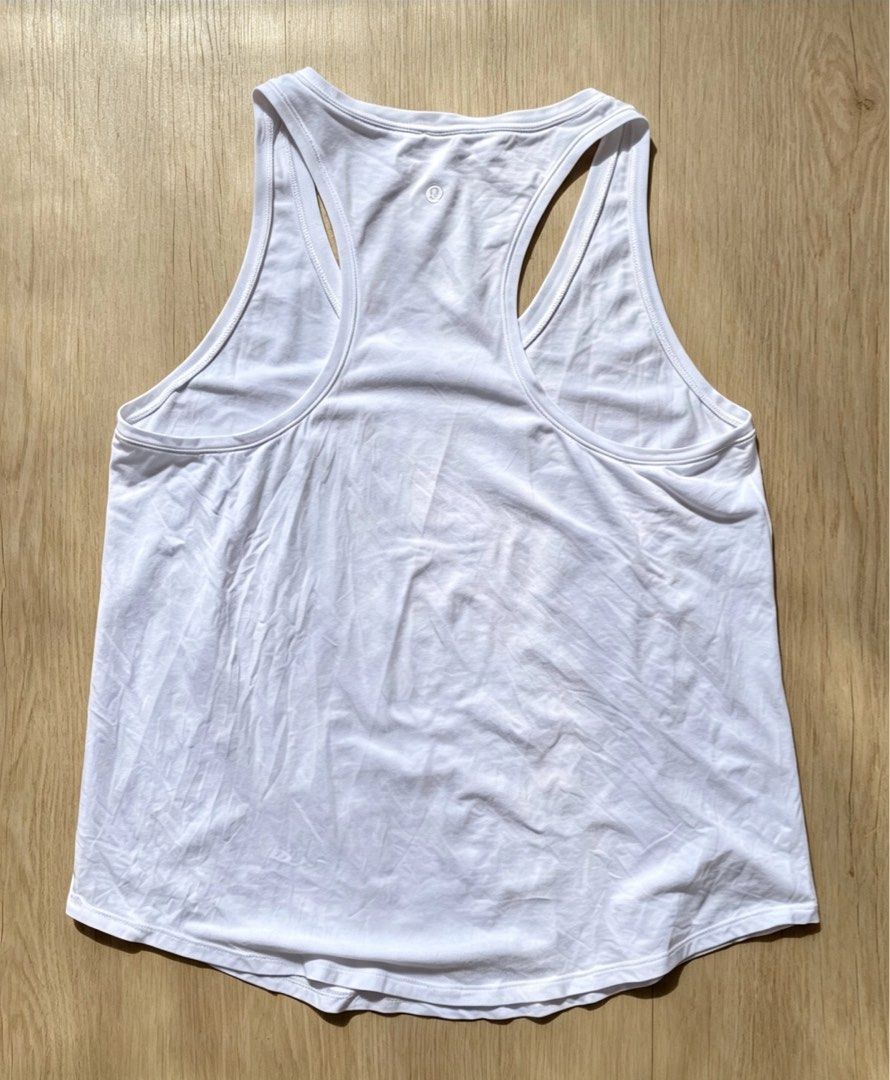 Lululemon White Racerback Tank Top (Category: Activewear) located in Manila. Submitted by tygaangub1096 (Listing ID 1456920924, Image 3). Description: - White Lululemon tank top - Racerback style - Ideal for workouts or casual wear - Made with soft and breathable fabric - Easy to pair with any outfit - A comfortable wardrobe staple - Size 12 on tag - 19.5 width 26.5 length - Add shipping fee .
