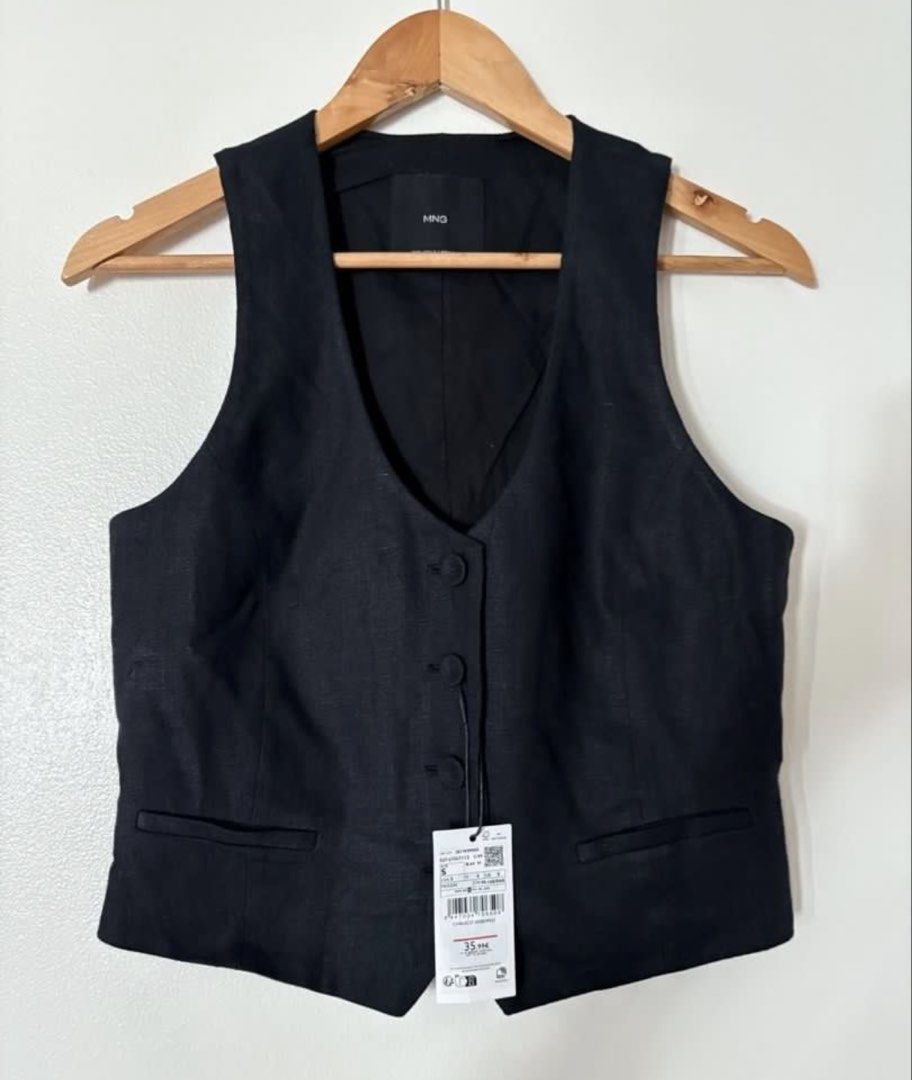Mango Linen Suit Waistcoat Black - Small (Category: Sleeveless) located in Taguig. Submitted by Rveebee (Listing ID 1456835406, Image 2). Description: - MNG black waistcoat - Linen blend fabric - Button front closure - Two front pockets - Versatile for layering over shirts or dresses - Suitable for both casual and formal occasions BRAND NEW with tag.