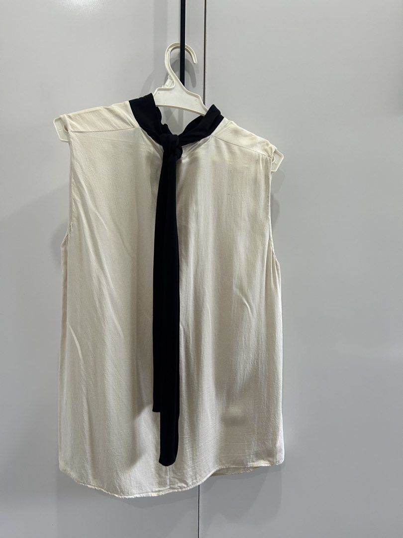 Mango Sleeveless Beige with Black Ribbon-Tie (Category: Sleeveless) located in San Juan City. Submitted by curatedbymae (Listing ID 1456851928, Image 3). Description: Item: Mango Sleeveless Beige with Black Ribbon-Tie - Chest: 13.5 inches - Length (shoulder to hem): 25 inches Size: US-Small RFS: decluttering Mode of Payment: GCASH/MAYA Shipping: Grab/J&T/Lalamove (Buyer will shoulder shipping fee.).