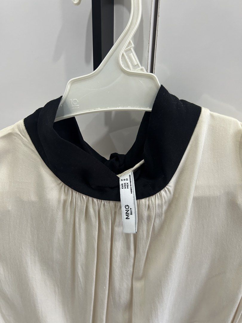 Mango Sleeveless Beige with Black Ribbon-Tie (Category: Sleeveless) located in San Juan City. Submitted by curatedbymae (Listing ID 1456851928, Image 2). Description: Item: Mango Sleeveless Beige with Black Ribbon-Tie - Chest: 13.5 inches - Length (shoulder to hem): 25 inches Size: US-Small RFS: decluttering Mode of Payment: GCASH/MAYA Shipping: Grab/J&T/Lalamove (Buyer will shoulder shipping fee.).