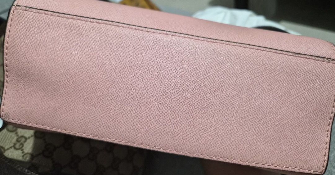 Michael Kors Pink Leather Crossbody Bag (Category: Luxury Bags & Wallets) located in Caloocan City. Submitted by rmdesilva (Listing ID 1456799385, Image 3). Description: Pink Michael Kors crossbody bag. Saffiano leather. Gold hardware details. Interior has a zip pocket and a slip pocket. Comes with a detachable crossbody strap. Great for everyday use..