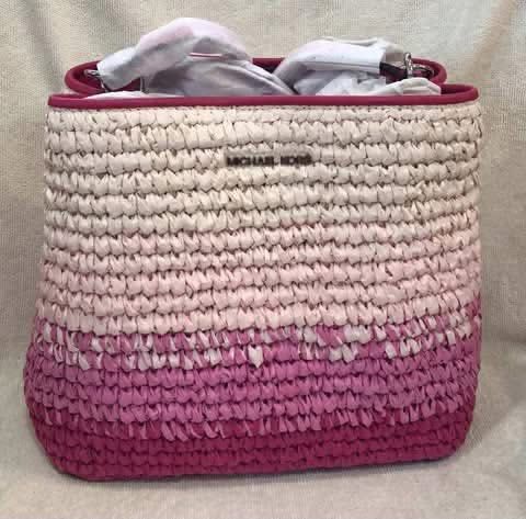 MICHAEL KORS Pratt Medium Ombré Straw Shoulder Bag (Category: Shoulder Bags) located in Santa Cruz. Submitted by vendrenee (Listing ID 1456785079, Image 1). Description: • Shoulder bag • Straw • 100% straw • Trim: 60% polyurethane/20% cotton/20% polyester • Silver-tone hardware • 10.5”W X 8.75”H X 4.75”D • Handle drop: 11” • Interior details: center zip pocket • Lining: 100% polyester • Dust bag not included • Imported • Style # 35S5S3FS2W.