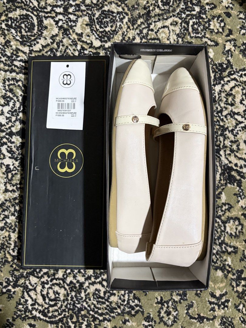 MICHAELA Women's Mary Janes (Category: Flats & Sandals) located in Meycauayan. Submitted by _jodieeee (Listing ID 1456910450, Image 2). Description: - Brand: MICHAELA - Color: Cream and Beige - Style: Ballet Flats / Mary Jane - Size: 37 - Features: Strap across the top with gold buckle detail, Cap toe design - Condition: Comes with original box RFS: Masikip sakin :(.