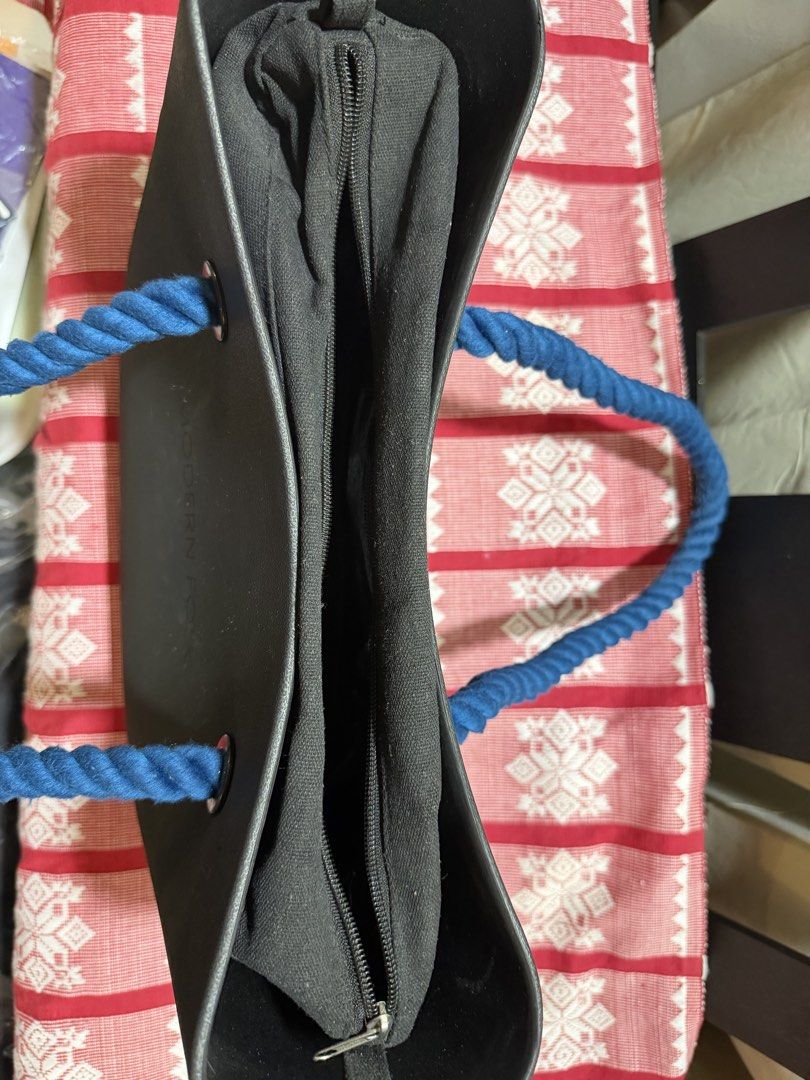 Modern Folk Tote Bag with Rope Handles (Category: Tote Bags) located in Cavite. Submitted by carizhai (Listing ID 1456905272, Image 2). Description: - Black medium tote bag from Modern Folk (local brand), popular in the early 2020s - Features thick blue rope handles with extra black rope handles - Interior zippered compartment (detachable) - Ideal for everyday use esp in this rainy season (water repellent) - Spacious for your essentials; perfect 