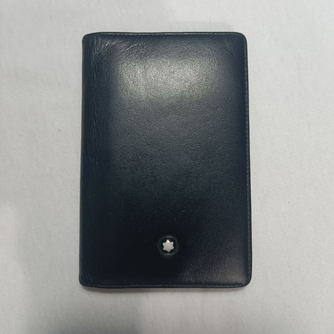 Mont Blanc Black Leather Card Holder (Category: Luxury Bags & Wallets) located in Manila. Submitted by _bluberr (Listing ID 1456923225, Image 1). Description: - Genuine Mont Blanc card holder - Crafted from premium black leather - Features multiple slots for essential cards - Subtle Mont Blanc logo embossed inside - Perfect for keeping your cards neatly organized - A timeless and elegant accessory.