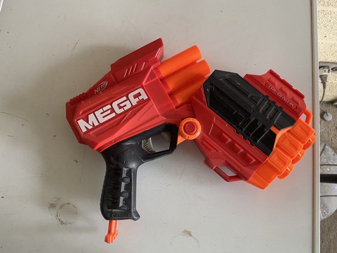 Nerf MEGA Tri-Break (Category: Action & Battle Toys) located in Binan City. Submitted by kyoshohuntr (Listing ID 1456789663, Image 3). Description: - Nerf Mega Tri-Break blaster - Striking red, black, and orange design - Fires powerful Nerf Mega darts - Perfect for exciting outdoor battles - Shows minor scuffs from normal play - Fully functional and ready for action!.