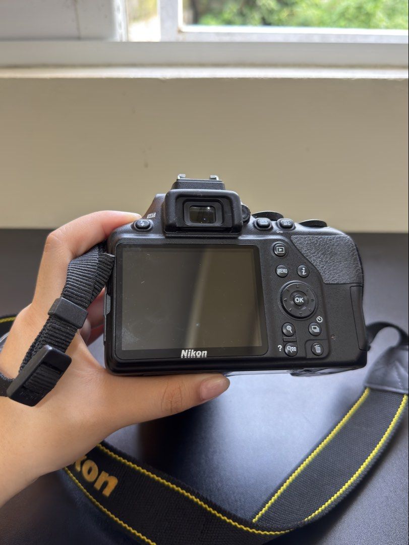 Nikon D3500 DSLR Camera (Category: Cameras) located in Manila. Submitted by livemountain.5b7934 (Listing ID 1456864181, Image 3). Description: Letting go of my Nikon D3500! 🤍 Perfect for beginners, travel photography, and anyone looking to get into DSLR photography. ✨ Nikon D3500 ✨ Lightweight & beginner-friendly ✨ Comes with lens + charger + bag ✨ Barely used / stored for years ✨ Selling as-is 📌 Note: Camera has been stored for a long time and