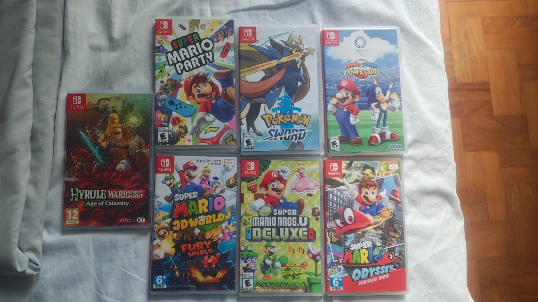 Nintendo Switch Games (Category: Nintendo) located in Singapore. Submitted by square.0608 (Listing ID 1456792221, Image 1). Description: 40 each - Nintendo Switch Game Bundle - Includes: Super Mario Party - Includes: Pokemon Sword and Shield - Includes: Mario & Sonic at the Olympic Games Tokyo 2020 - Includes: Hyrule Warriors: Age of Calamity - Includes: Super Mario 3D World + Bowser's Fury - Includes: Super Mario Odyssey - Includes: Super Mario 
