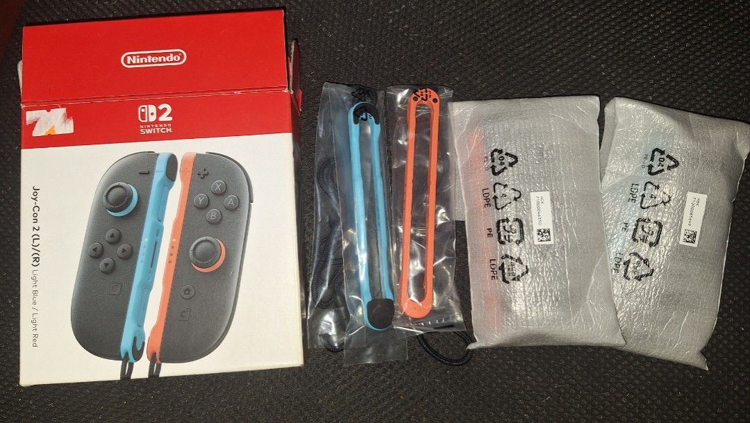 Nintendo Switch Joy-Con 2 (L)/(R) Light Blue / Light Red (Category: Controllers) located in Manila. Submitted by jheveng (Listing ID 1455771861, Image 3). Description: - Genuine Nintendo Switch Joy-Con (L)/(R) controllers - Colors: Light Blue (Left) and Light Red (Right) - Includes original box and all accessories shown in photos - Ideal for multiplayer gaming sessions - Great as a replacement for lost or damaged controllers.
