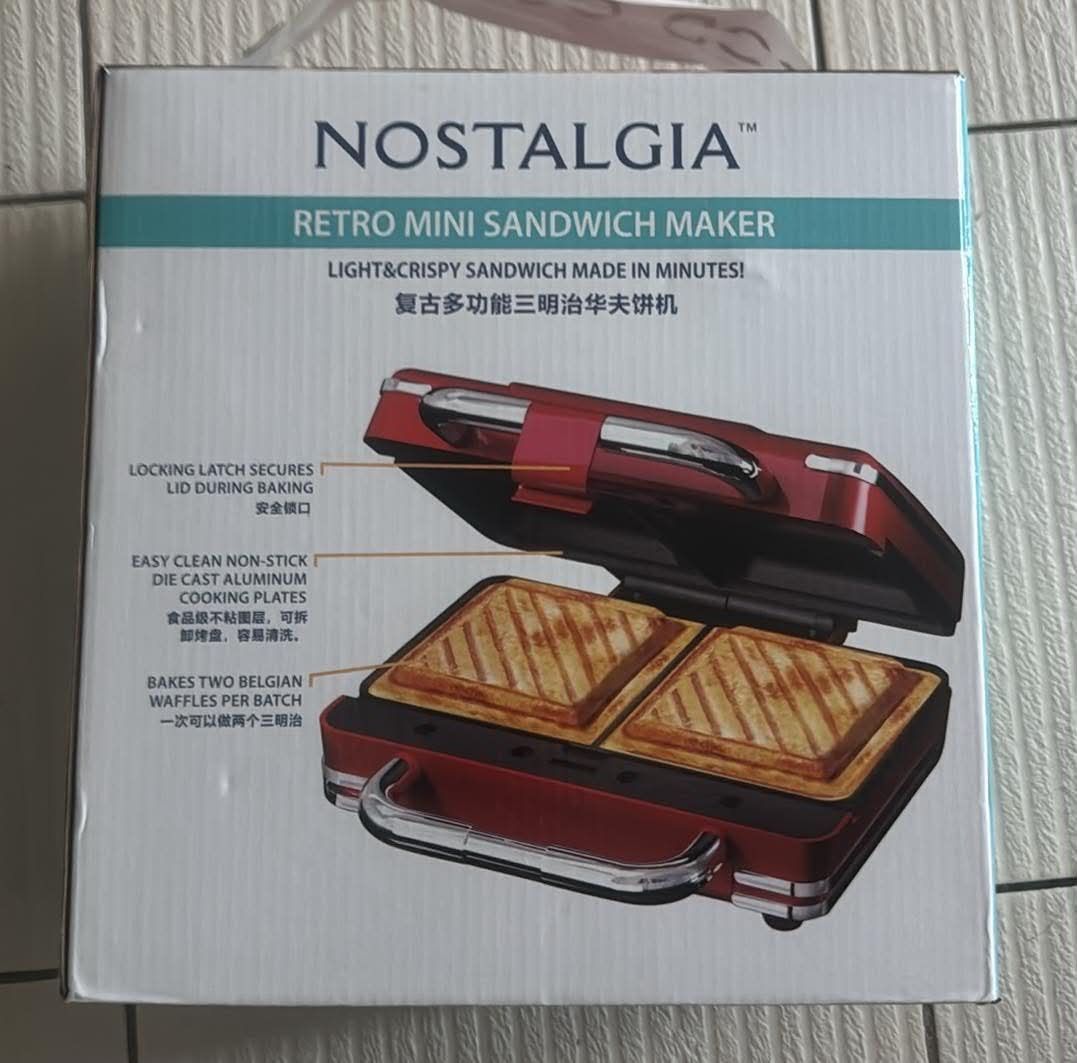 Nostalgia Retro Mini Sandwich Maker (Category: Cookware & Accessories) located in Marikina City. Submitted by thevelvetcat (Listing ID 1456798780, Image 1). Description: Makes 2 golden-brown sandwiches per batch Dual cooking plates Even heat distribution Easy-to-clean non-stick cooking plates Locking latch for secure cooking Retro-inspired design Perfect for sandwiches, panini and quick snacks Condition: Brand New / Boxed.