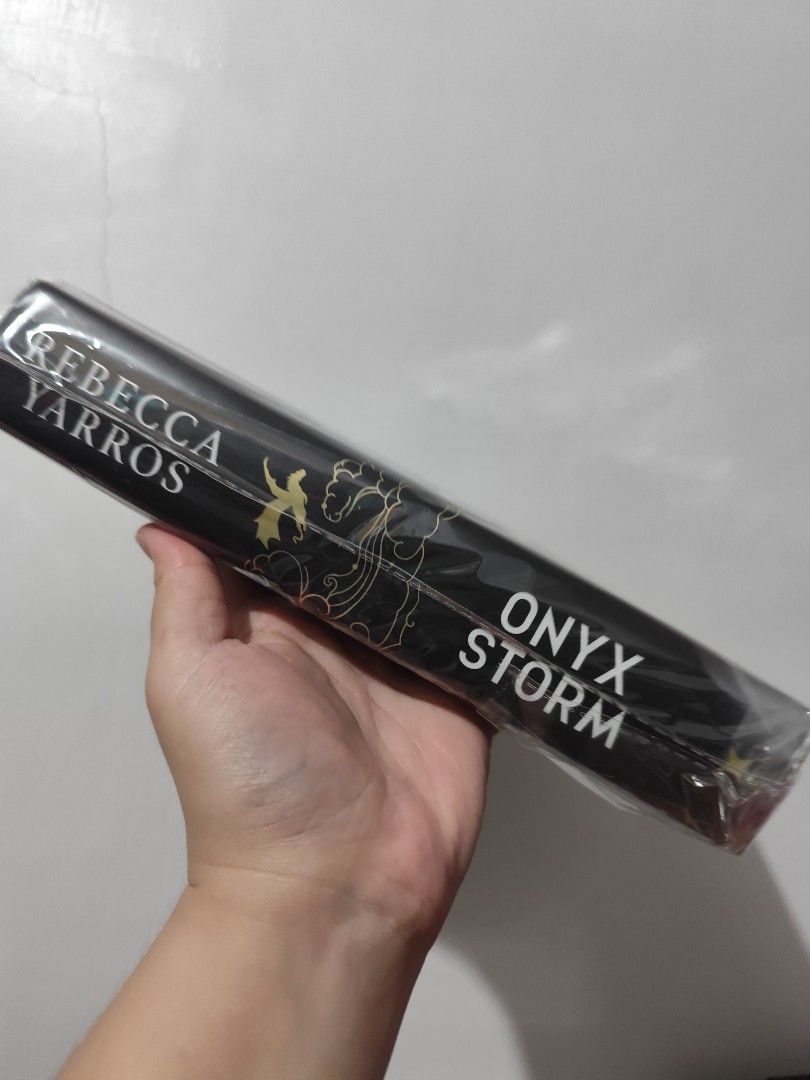 Onyx Storm (Regular HB Edition) (Category: Storybooks) located in Bulacan. Submitted by mikkaryne (Listing ID 1456842126, Image 2). Description: - Onyx Storm by Rebecca Yarros - Book 2 in The Empyrean Series - Highly recommended fantasy read.
