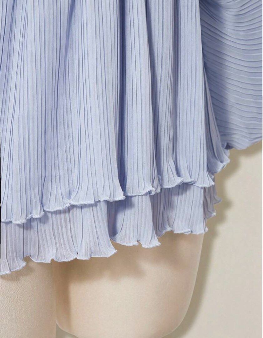Periwinkle Pleated Chiffon Romper (Category: Blouses) located in Quezon City. Submitted by kleanklutter (Listing ID 1456946105, Image 3). Description: - Dolman sleeves - Fits small-semi large - Garterized sleeves and waist - With inner shorts lining - Cinched waist - Ruffled, tiered hem - Back ribbon tie - All-over pleated texture - Versatile for dressing up or down.