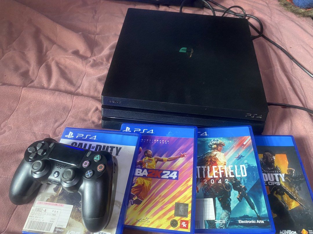 PlayStation 4 Pro (1tb) Console with Controller and Games (Category: PlayStation) located in Manila. Submitted by cosmiceagle-23bc (Listing ID 1456872322, Image 1). Description: - PlayStation 4 Pro Console - Includes 1 Controller - 4 Games Included: - Call of Duty: Advanced Warfare - NBA 2K24 - Battlefield 2042 - Another Call of Duty Title - Console in good working condition - Games in original cases - Ready for immediate enjoyment!.