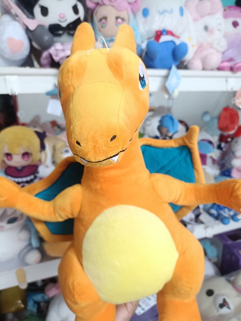 Pokemon Charizard Plush Toy (Category: Plushies & Soft Toys) located in Baguio. Submitted by jamela.joy.shoppe15 (Listing ID 1456951106, Image 2). Description: - Orange Charizard plush toy - Wings are spread out - Brand new with tags attached - Approximately 12 inches tall - Made with soft and cuddly material - Ideal for Pokemon fans, display, or cuddling.