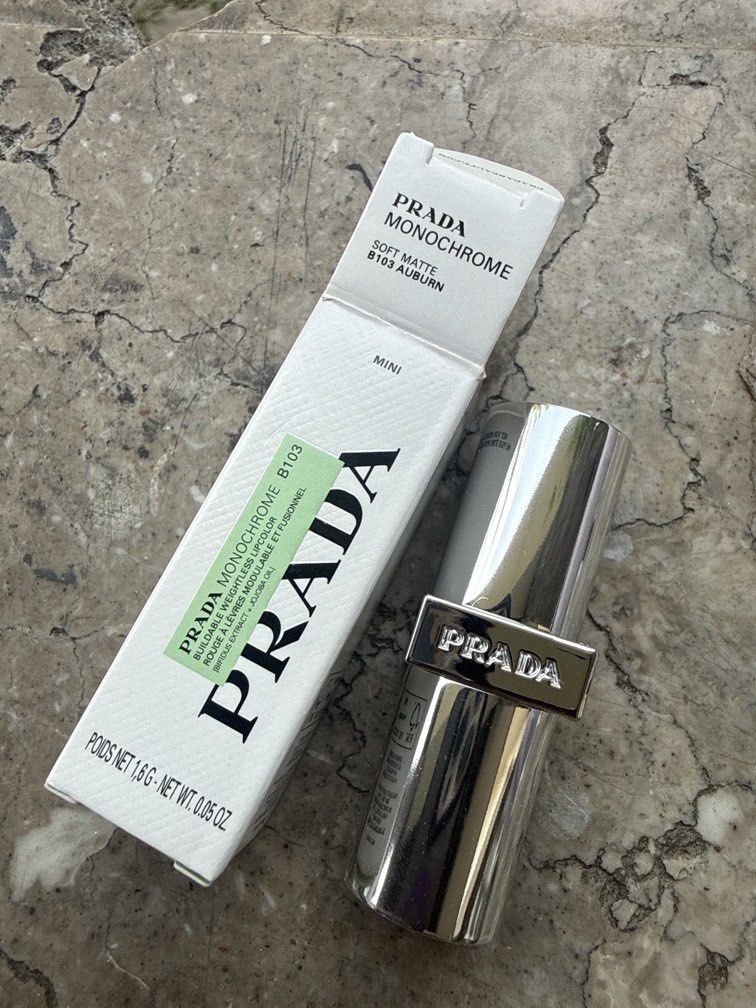 Prada Monochrome Soft Matte Lipstick B103 Auburn Mini (Category: Makeup) located in Angeles City. Submitted by migs_font29 (Listing ID 1456922708, Image 1). Description: - Prada Monochrome Soft Matte Lipstick - Shade: B103 Auburn - Size: Mini - Finish: Soft Matte - Color: Beautiful auburn hue - Condition: Comes in original box - Ideal for: Adding a pop of color to your look.