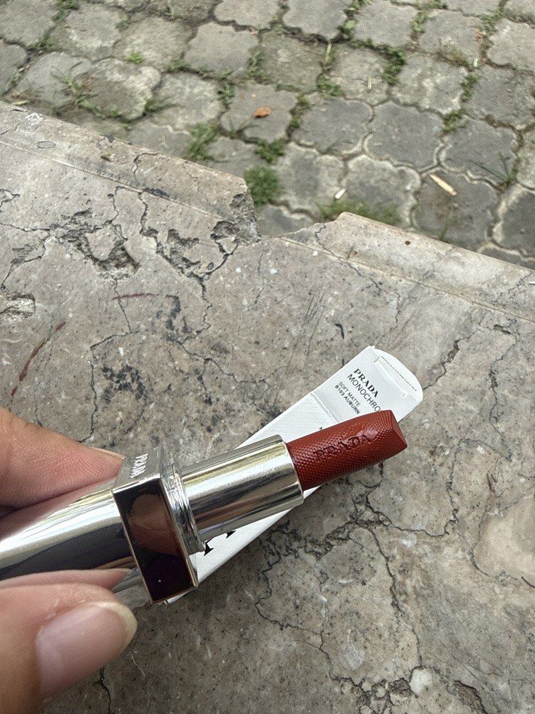 Prada Monochrome Soft Matte Lipstick B103 Auburn Mini (Category: Makeup) located in Angeles City. Submitted by migs_font29 (Listing ID 1456922708, Image 2). Description: - Prada Monochrome Soft Matte Lipstick - Shade: B103 Auburn - Size: Mini - Finish: Soft Matte - Color: Beautiful auburn hue - Condition: Comes in original box - Ideal for: Adding a pop of color to your look.