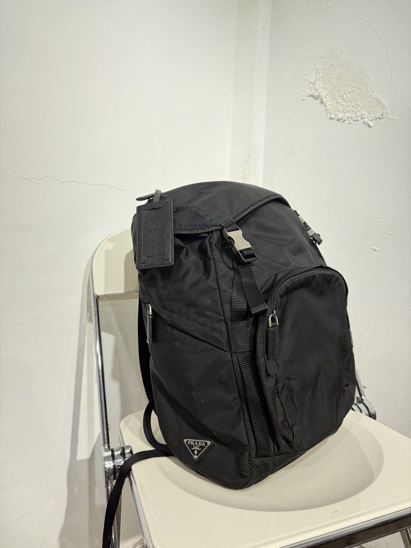 Prada Nylon Backpack Black (Category: Luxury Bags & Wallets) located in Manila. Submitted by _lokithrift_ (Listing ID 1456818638, Image 1). Description: Prada black nylon backpack - Iconic Prada triangle logo - Secure buckle closures - Adjustable straps for comfort - Spacious interior for essentials - Durable and stylish design - Perfect for daily use or travel.