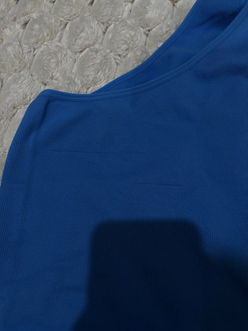 Primark Blue One Shoulder Ribbed Crop Top Size S (Category: Sleeveless) located in Angeles City. Submitted by declutter_q2222 (Listing ID 1456933988, Image 3). Description: - Blue one-shoulder crop top from Primark - Ribbed texture - Size S - Material: Nylon and elastane blend - Versatile: Great for workouts or casual wear - Please check photos for any minor run.