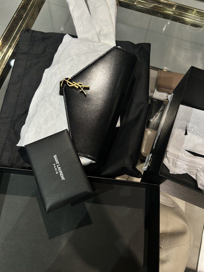 SAINT LAURENT Mini Envelope Crossbody Bag (Category: Luxury Bags & Wallets) located in Quezon City. Submitted by maekuuh (Listing ID 1456880167, Image 2). Description: -Comes with dust bag and orig box -Leather exterior and lining -Made in Italy -Flap top with gold-tone lift clasp cassandre closure -One main compartment -Interior slip and zipper pockets -Detachable and adjustable leather shoulder strap -Measures approx 19 cm W x 12 cm H x 3 cm D 