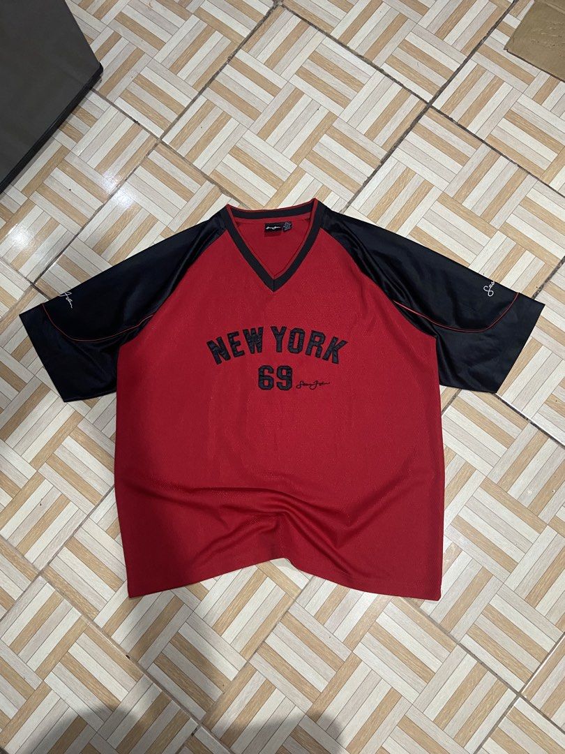 Sean John y2k (Category: Activewear) located in Manila. Submitted by ramoncitodee (Listing ID 1456942085, Image 1). Description: - Brand: Sean John - Design: 'New York 69' graphic - Color: Red body with black sleeves - Neckline: V-neck - Style: Casual wear - Condition: Good, with some signs of wear.