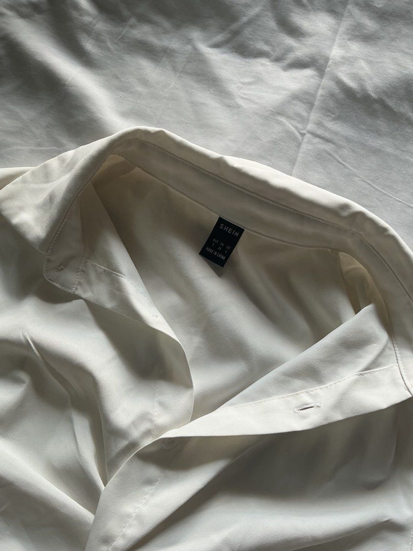 SHEIN White Twist Front Cropped Shirt (Category: Blouses) located in Candon. Submitted by czaeya (Listing ID 1456791056, Image 2). Description: ♡ never been used, was stored for a long time ♡ rfs: should have bought xs instead ♡ loc: candon, ilocos sur ♡ payment first policy! <33 ♡ send a message if interested :) mod: jnt (sf is buyer’s expense) mop: gcash or bank transfer (maribank).