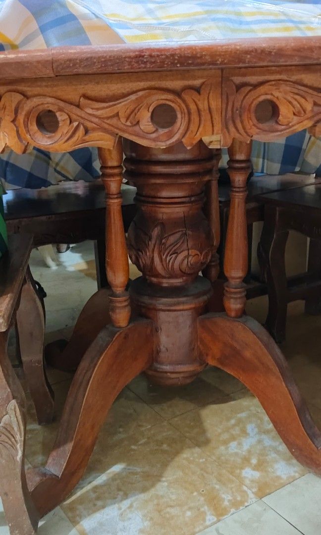 Solid wood 6 seater round dining table (Category: Tables & Sets) located in San Pedro. Submitted by cosmicbird.d08d5b (Listing ID 1456833015, Image 1). Description: Solid wood dining table paired with six matching chairs. Chairs are wobbly. Table has signs of cracked wood but doesn't affect the functionality. It has a tabletop lazy susan and comes with a glass top. Price negotiable. Location San Pedro, Laguna.