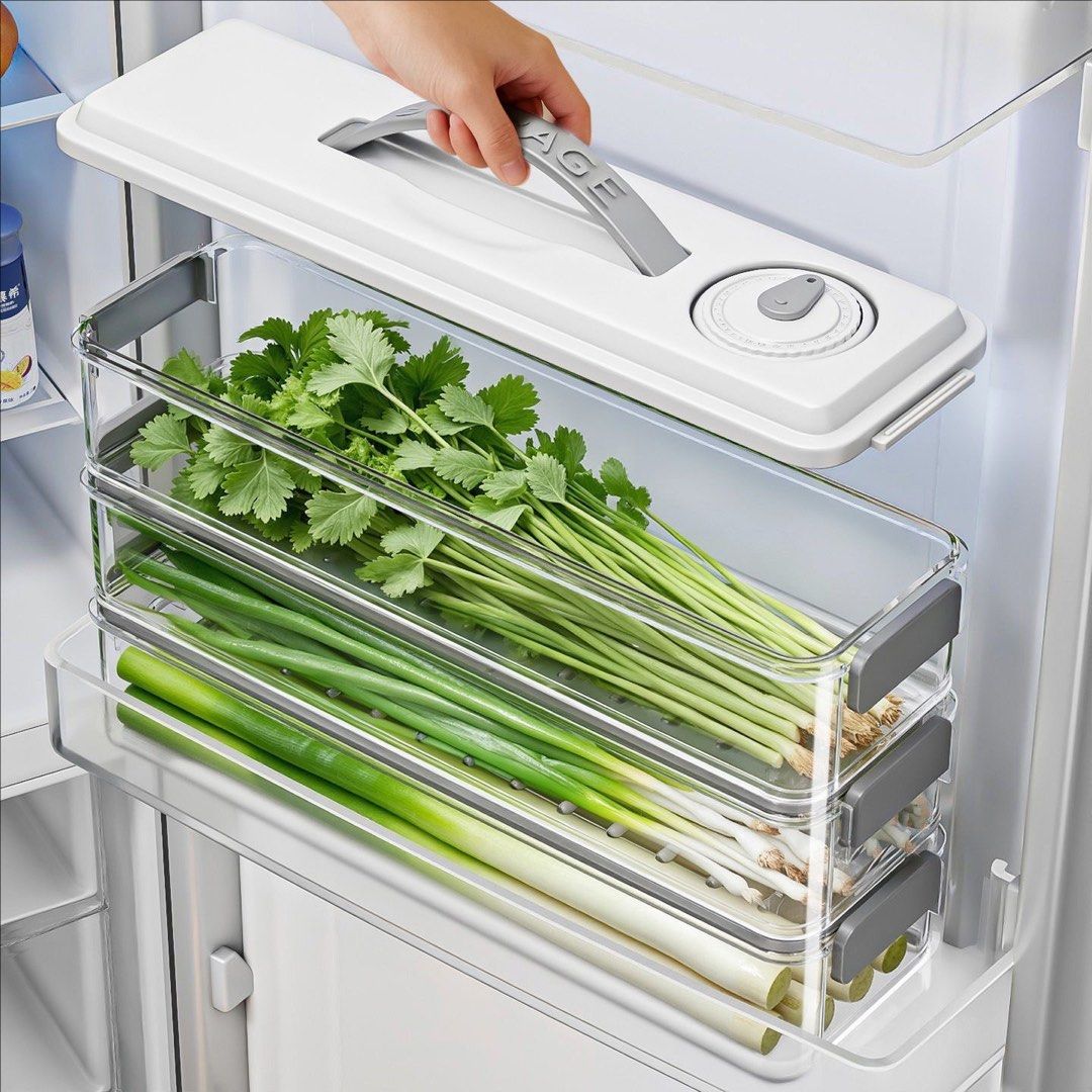 Stackable Refrigerator Vegetable Storage Container (Category: Food Organisation & Storage) located in Singapore. Submitted by echosweet (Listing ID 1456816653, Image 2). Description: - Keeps herbs and greens fresh for longer - Double seal locks in freshness and prevents odor transfer - Stackable design saves fridge space - Built-in handle for easy retrieval - Ideal for scallions, cilantro, and other vegetables.