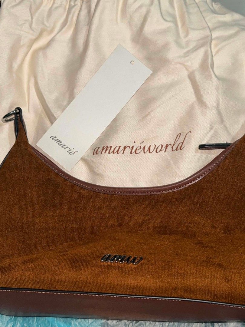 Suede Shoulder Bag in Espresso (Category: Shoulder Bags) located in Pasay City. Submitted by liveturtle0424 (Listing ID 1456908343, Image 2). Description: amw talia mini bag in suede color espresso ₱400 ONLYY - used only twice - with zipper compartment inside and a slip on compartment - bag has zipper closure - only has 1 bag strap - can be worn as a shoulder bag but hardware on one side of the strap has some metal discoloration/tarnishing - with